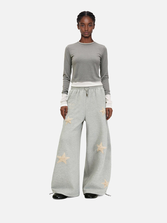 Pantalones deportivos holgados con apliques de estrella Eden de Aelfric