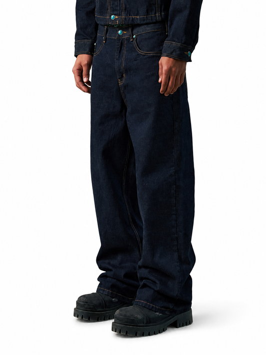 Ace Jolun dark indigo raw denim faux-turquoise jeans angled front view